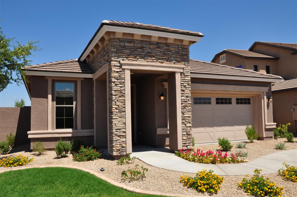 Modern suburban house with stone entry and garage