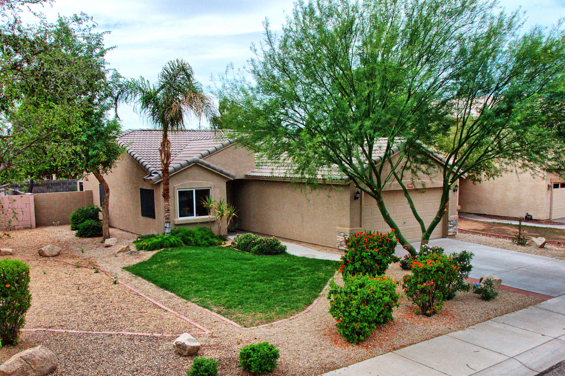 Southwestern suburban house with desert landscaping