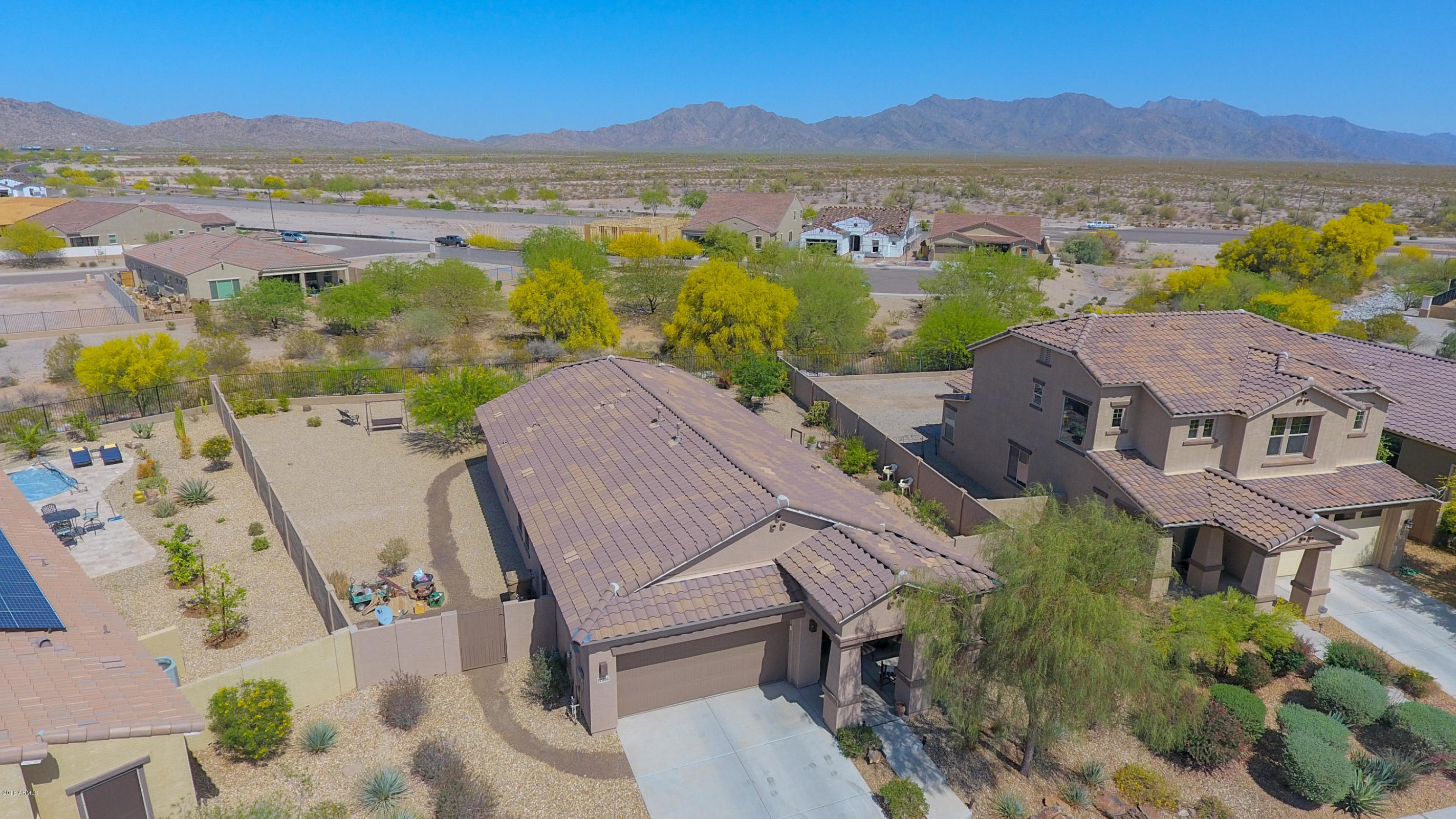 Aerial view of single-story desert home